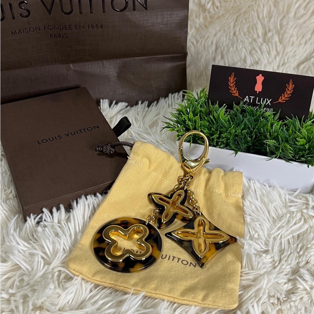 Authentic Louis Vuitton Insolence Bag Charm 
Brass Hardware